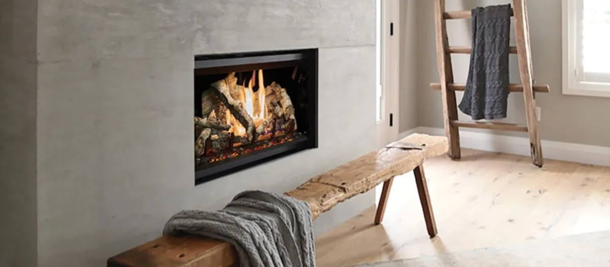 Modern living room with a built-in fireplace, wooden bench draped with a gray blanket, wooden ladder as décor, and natural light from a nearby window.