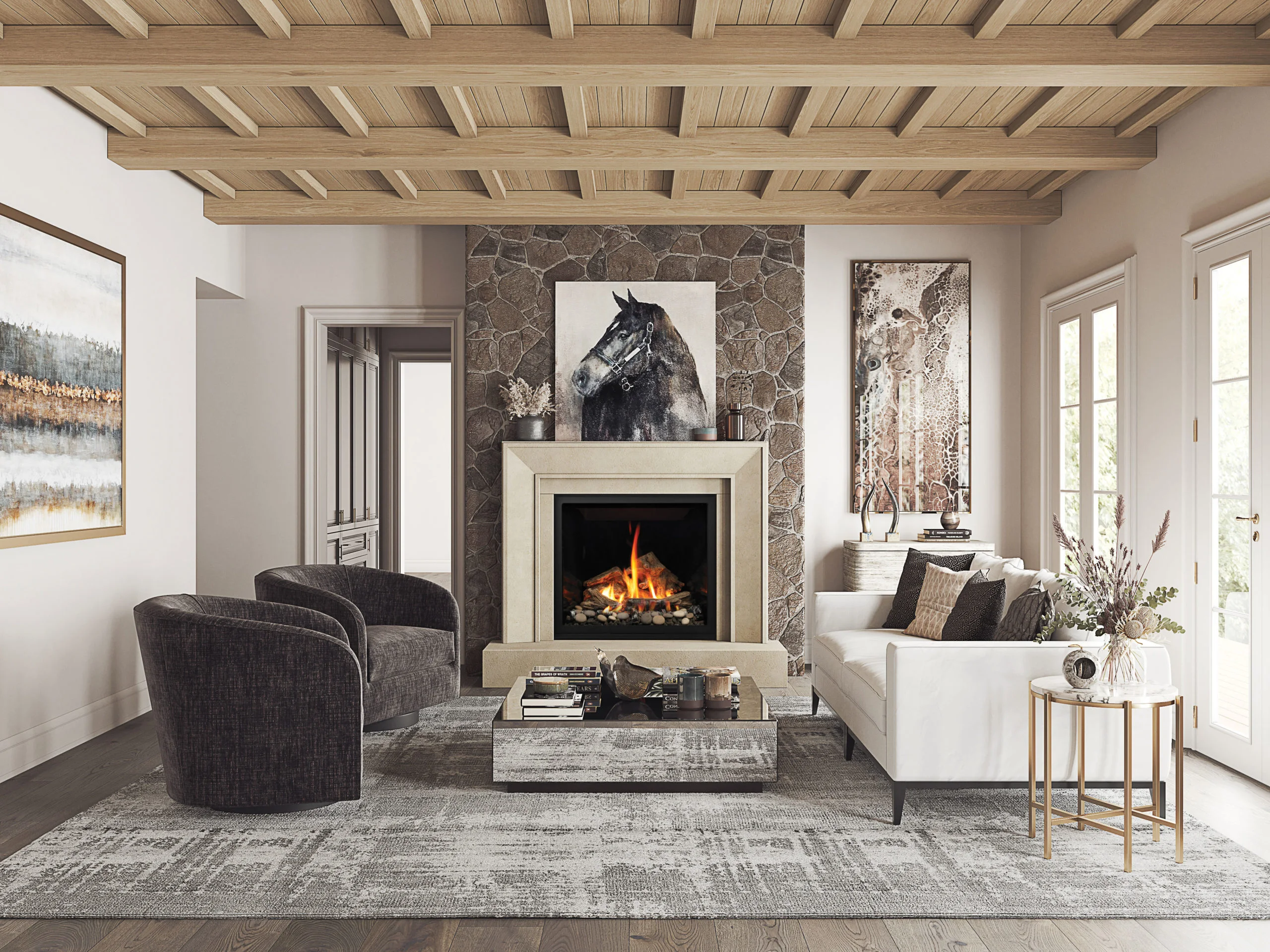 A cozy living room with a wooden beam ceiling, stone fireplace, and modern furniture, including dark armchairs, a white sofa, and a gray rug. Artworks above the fireplace and on the wall.