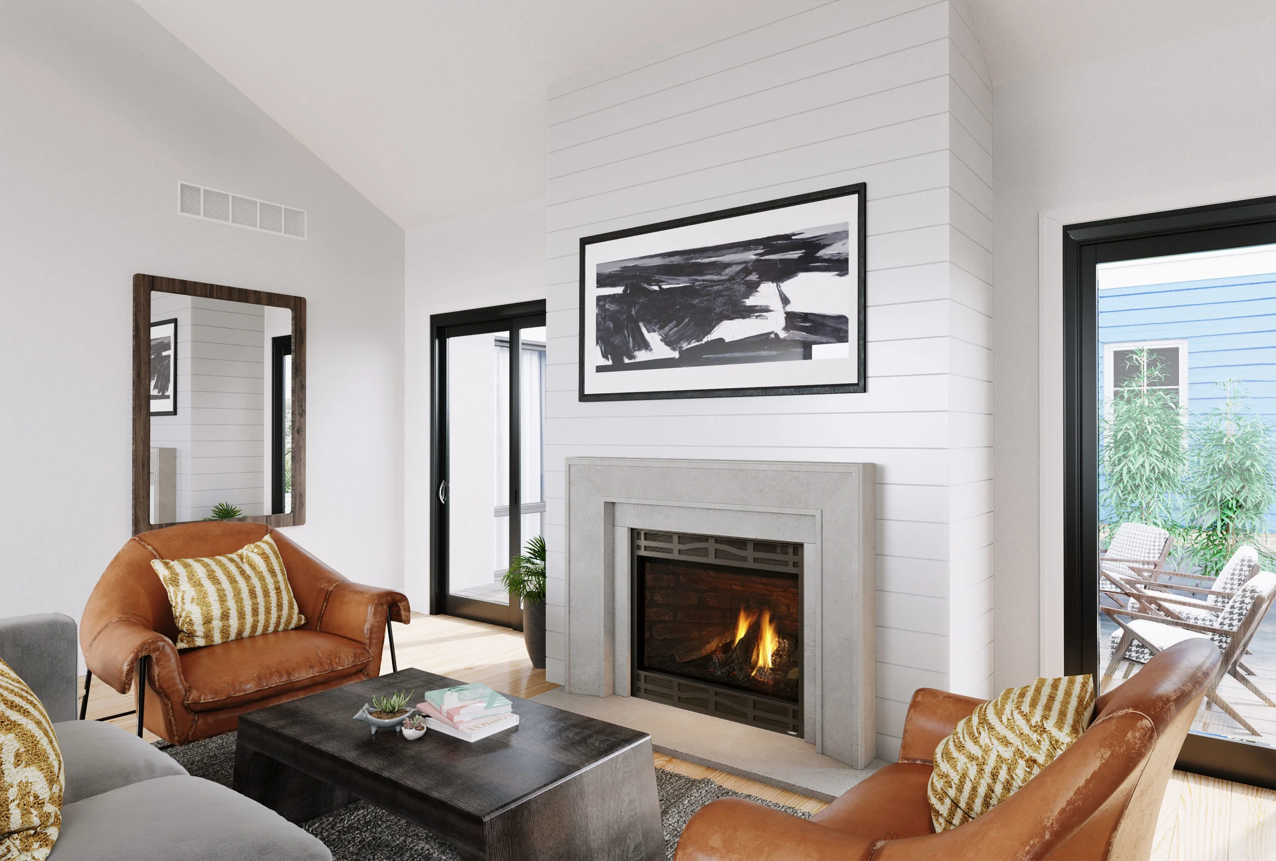 A modern living room with a fireplace, leather chairs, and a wooden coffee table. Large windows show an outdoor patio. Abstract art hangs above the fireplace and a mirror on the side wall.