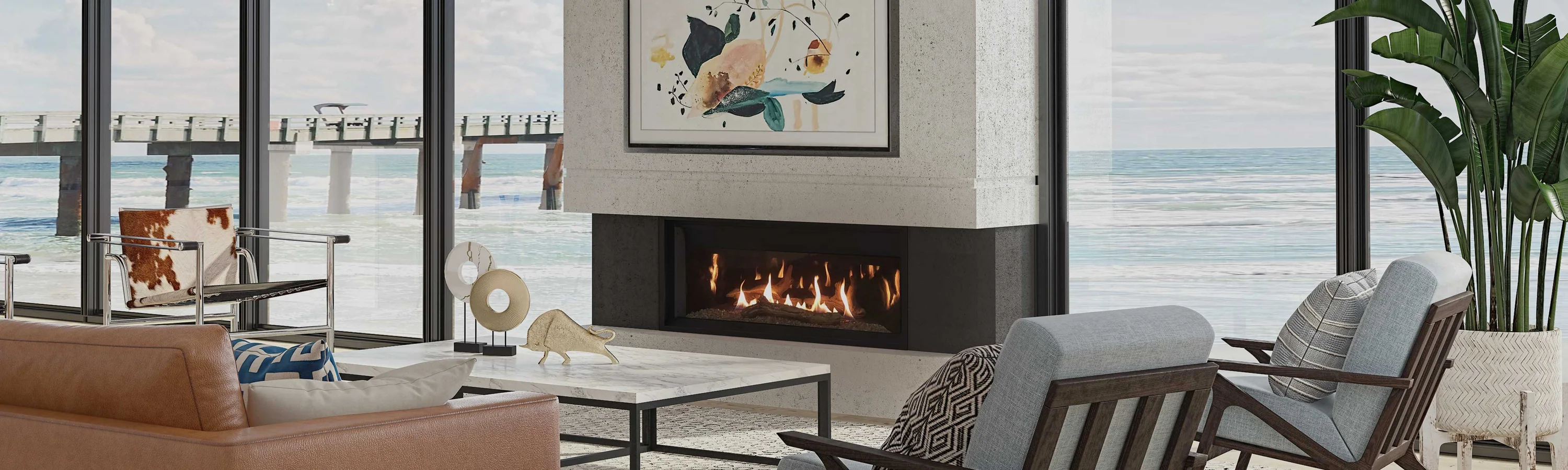 Modern living room with coastal view featuring a fireplace, abstract artwork, indoor plants, and stylish furniture, including a leather couch, patterned pillow, and marble coffee table.
