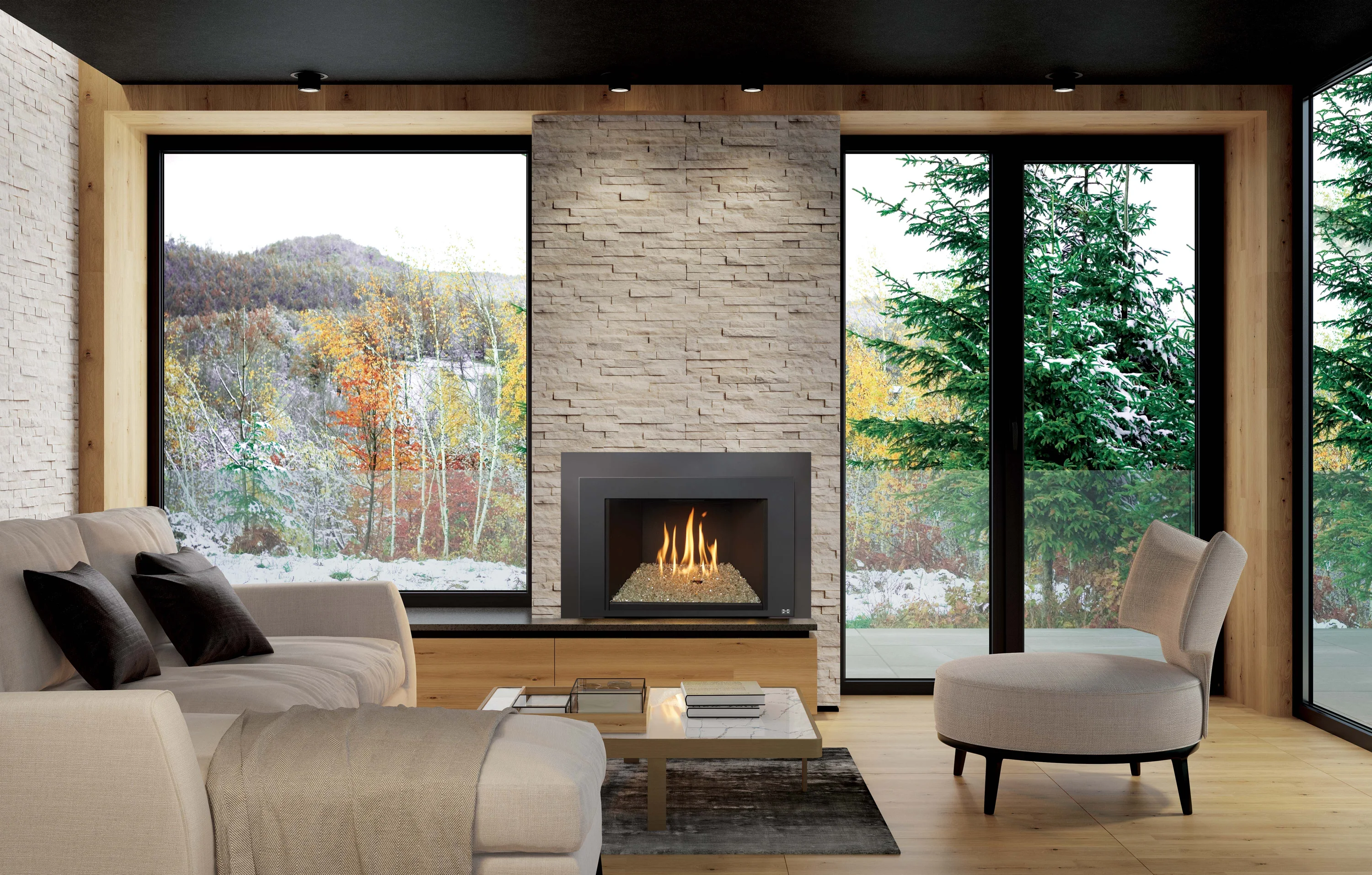 Modern living room with stone fireplace, burning gas fire, beige sofa and round chair, large windows showing snowy trees and autumn foliage