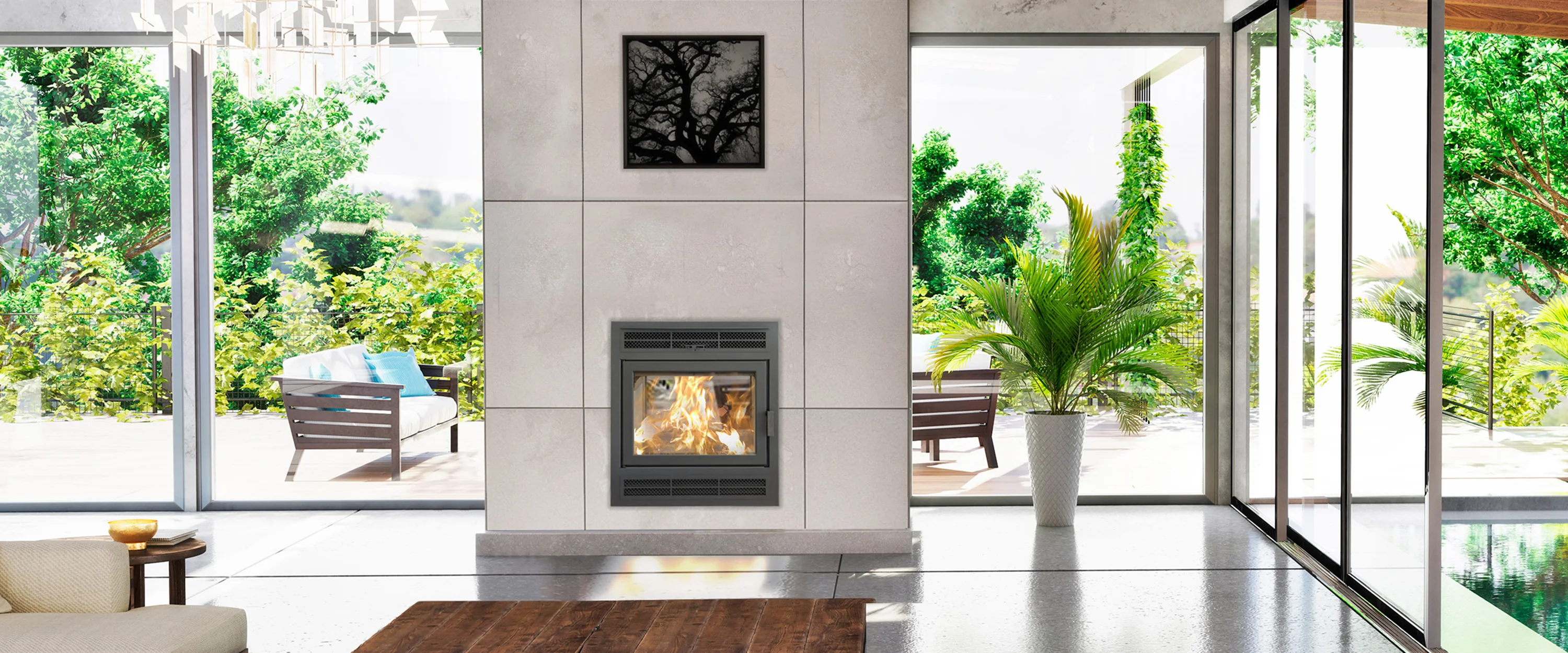 Modern living room with a fireplace in the center, glass doors and windows opening to a lush green garden. Wooden chairs with cushions are outside, and a tall indoor plant stands by the window.