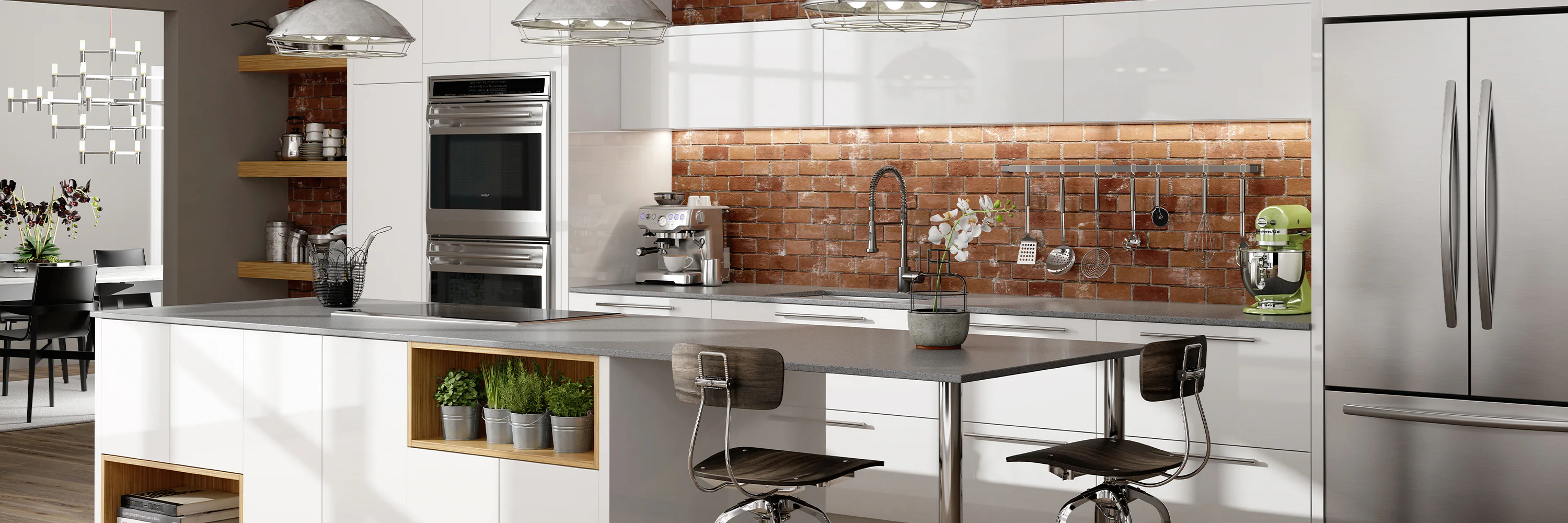 Modern kitchen with white cabinets, stainless steel appliances, and brick backsplash. Central island with seating, potted herbs, and an orchid. Dining area visible in the background.