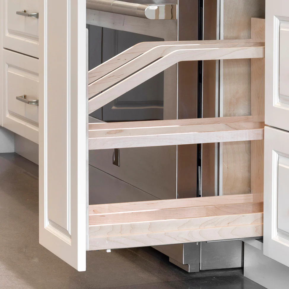 Open kitchen cabinet showing light-wood pull-out slatted storage shelves