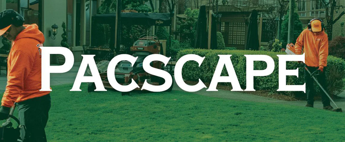 Landscapers in orange outfits work on a lawn with a hedge trimmer and leaf blower. The word 
