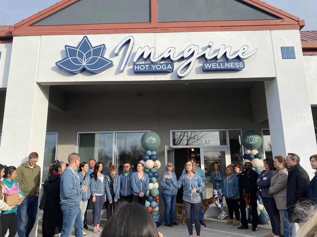 A group of people stand outside 
