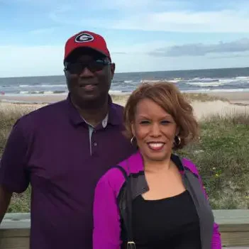 A couple smiling at the beach